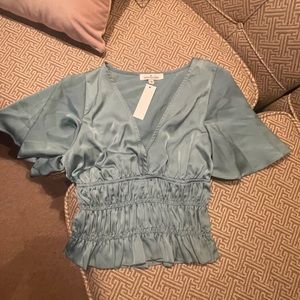LAST HOURS OR WILL BE DONATED!

NWT Teal blouse